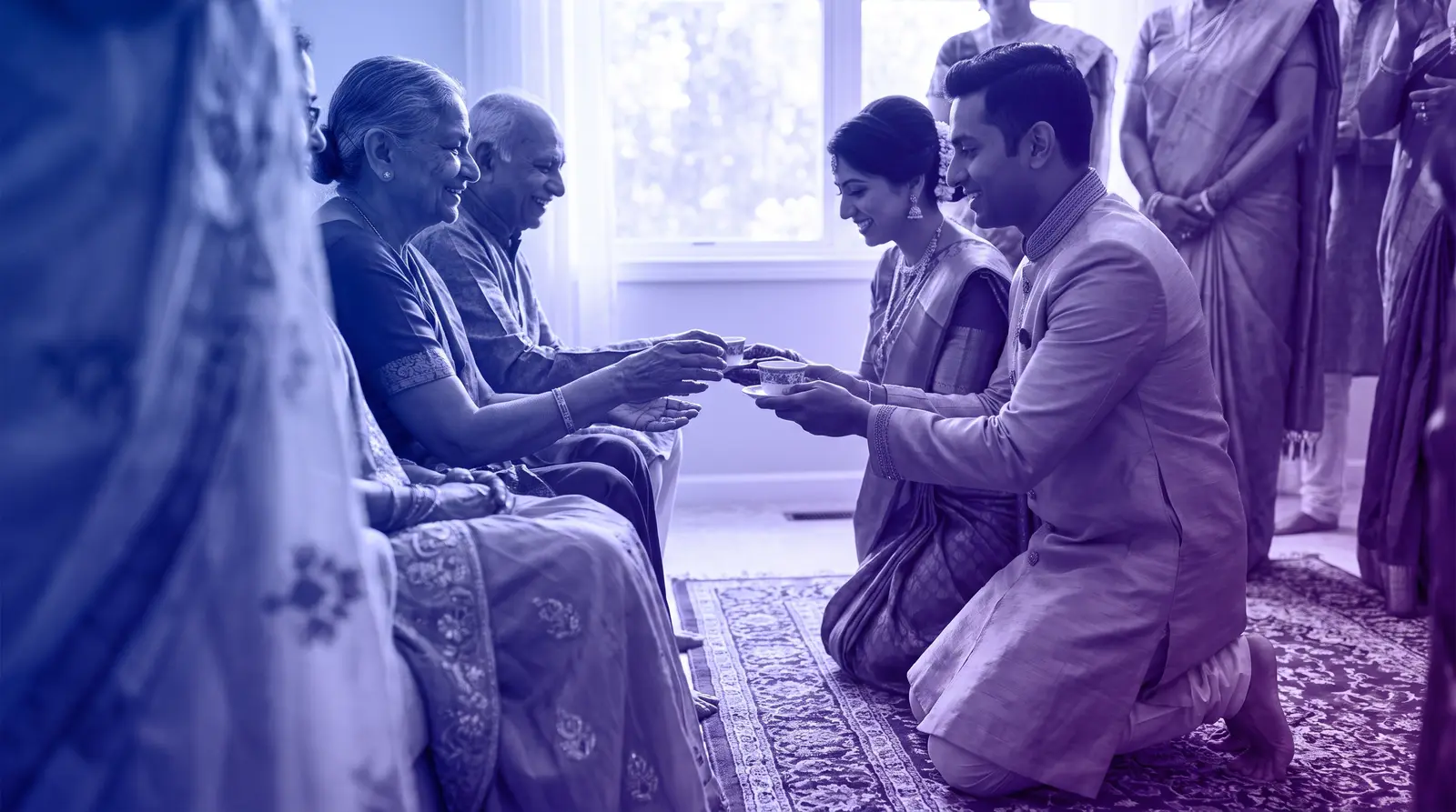 A couple performs a tea ceremony during an AAPI wedding