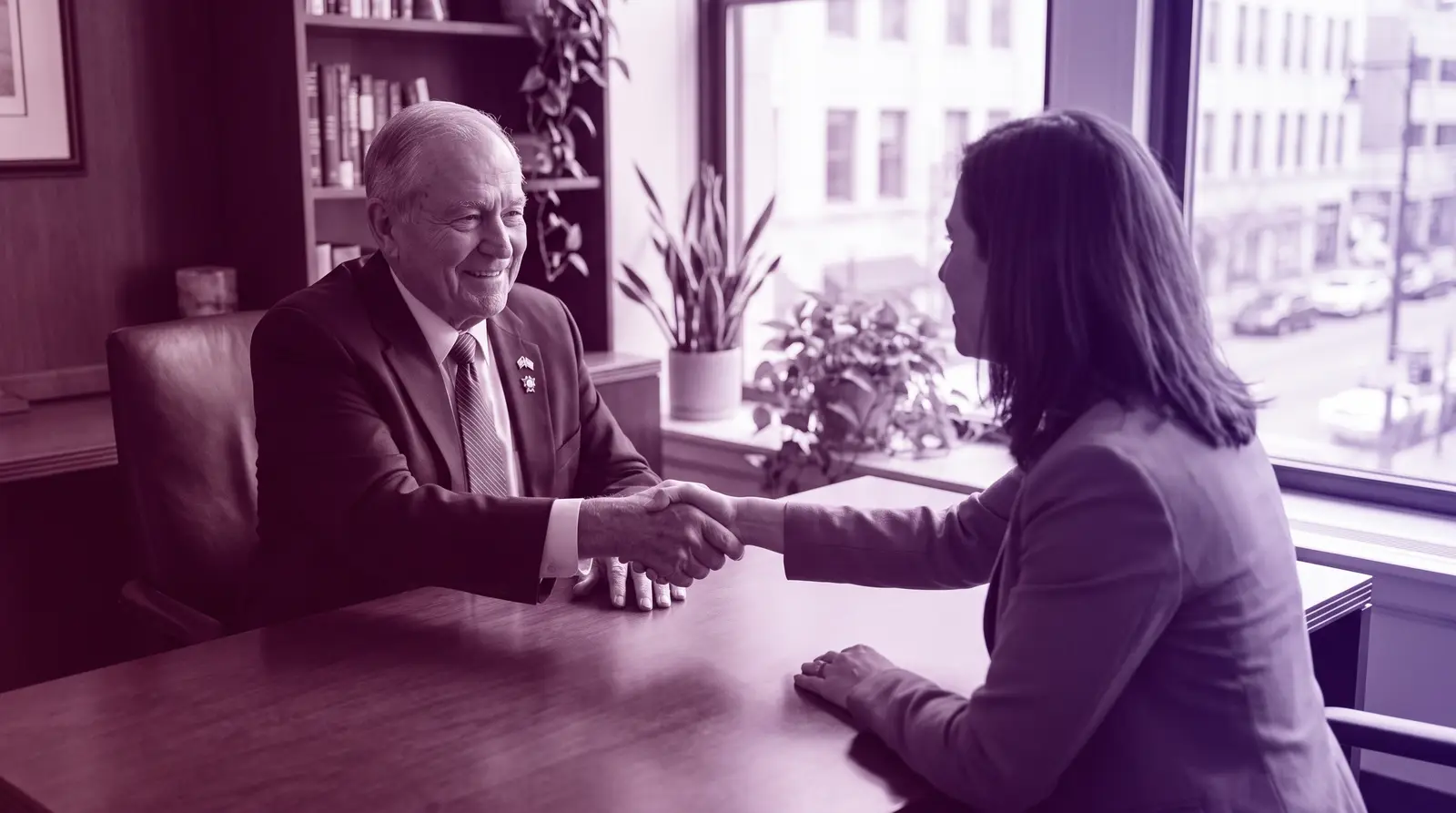 A veteran candidate shakes hands with an interviewer