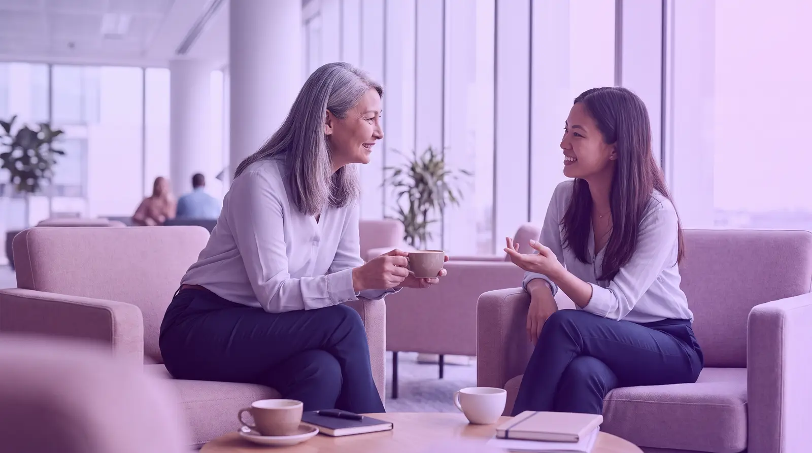 Women professionals talk in a leadership mentoring conversation