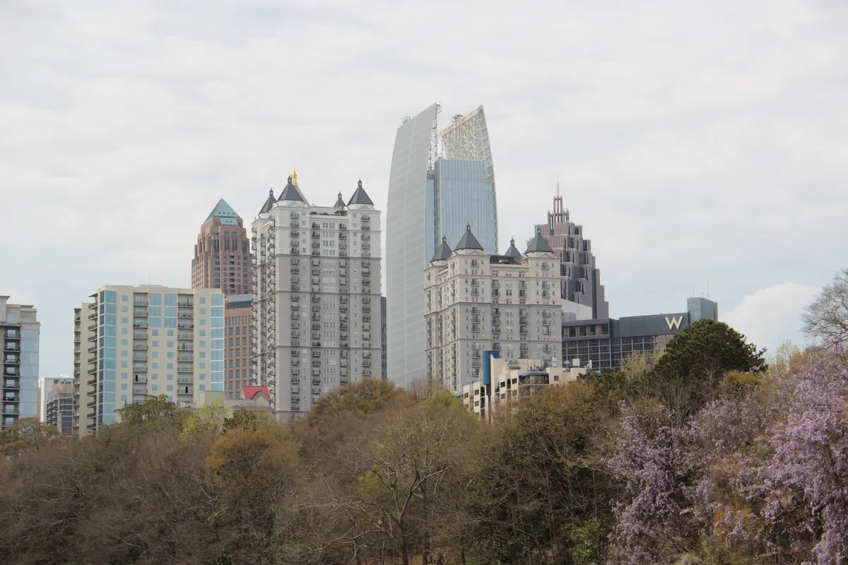 Midtown Atlanta's towers rising above the trees of Piedmont Park