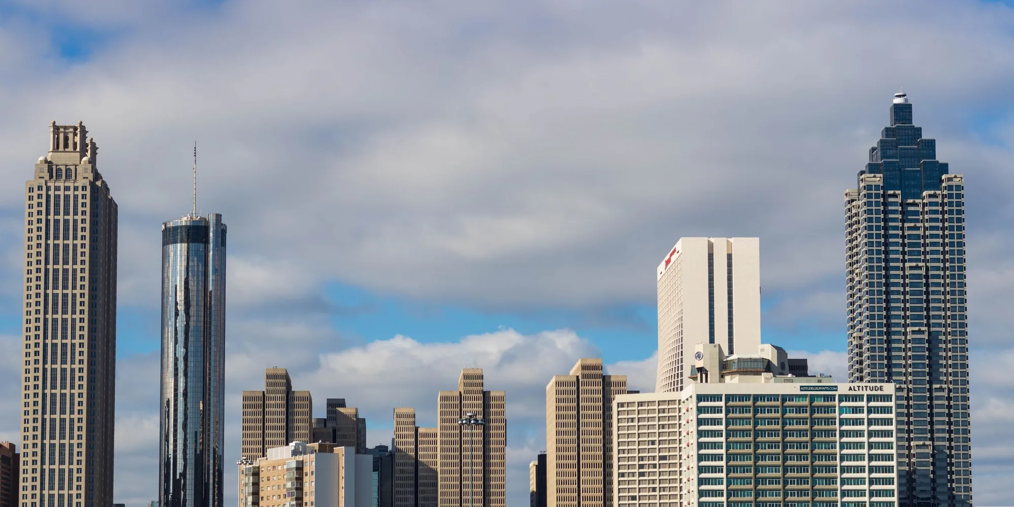 The downtown Atlanta skyline under afternoon cloud