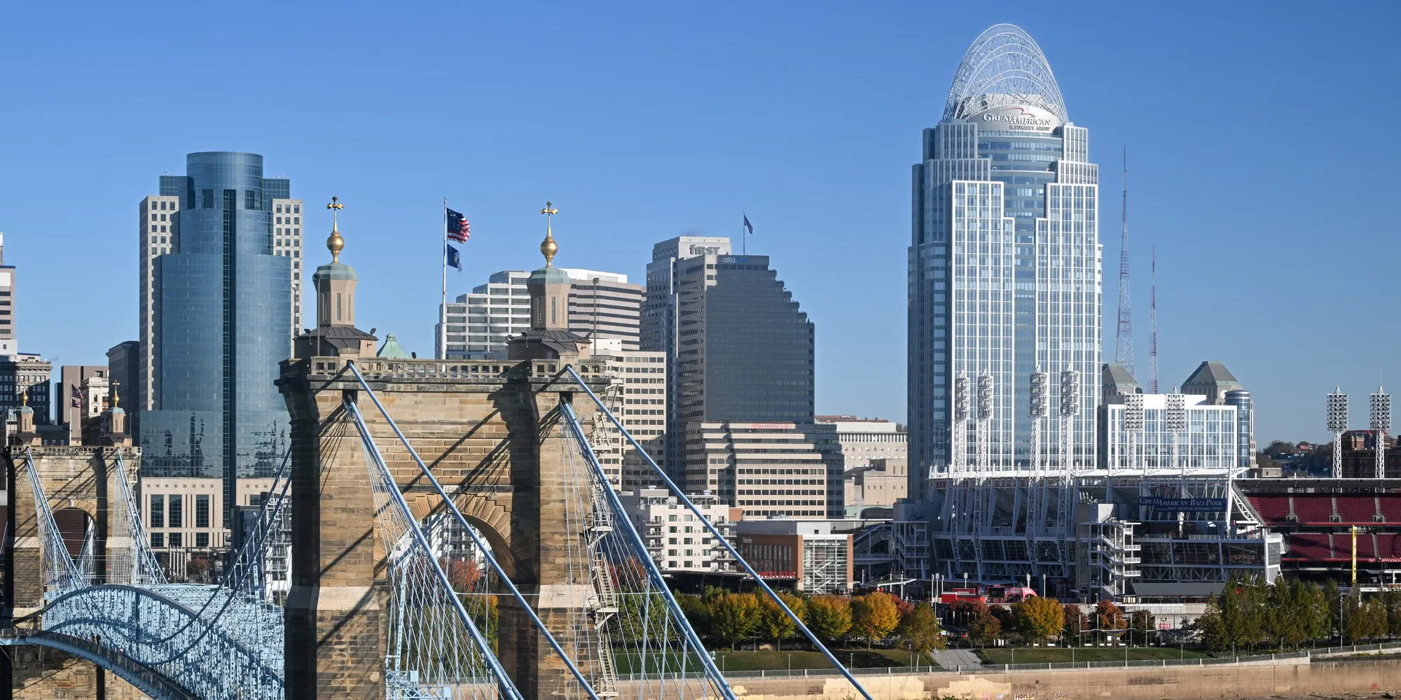 The John A. Roebling Suspension Bridge over the Ohio River with the Cincinnati skyline behind it