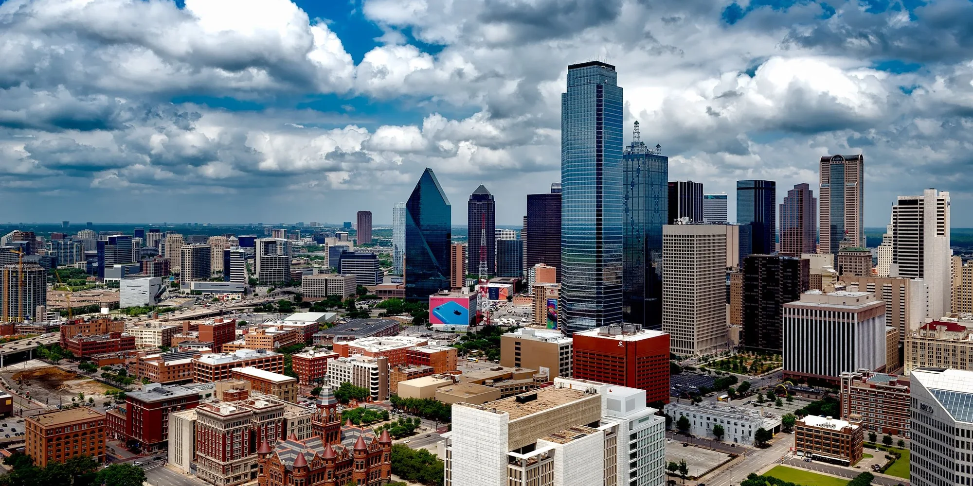 The downtown Dallas skyline under heavy cloud