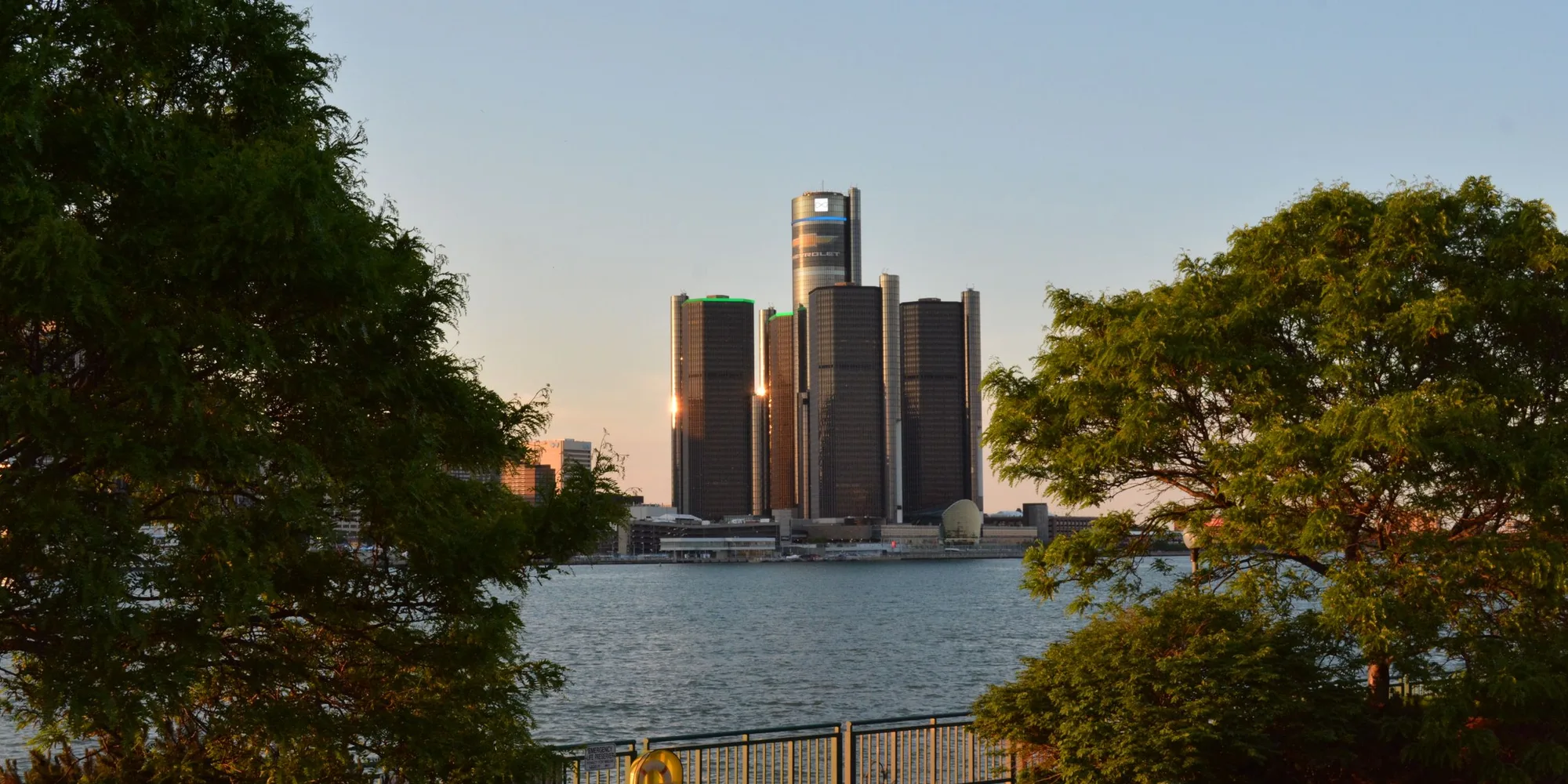 The Renaissance Center seen across the Detroit River at sunset