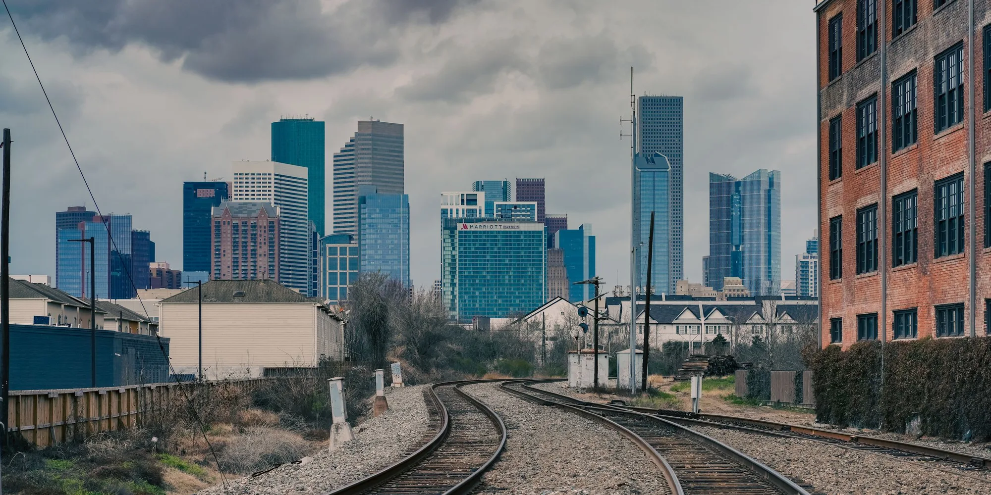 The downtown Houston skyline seen from the rail line east of the city