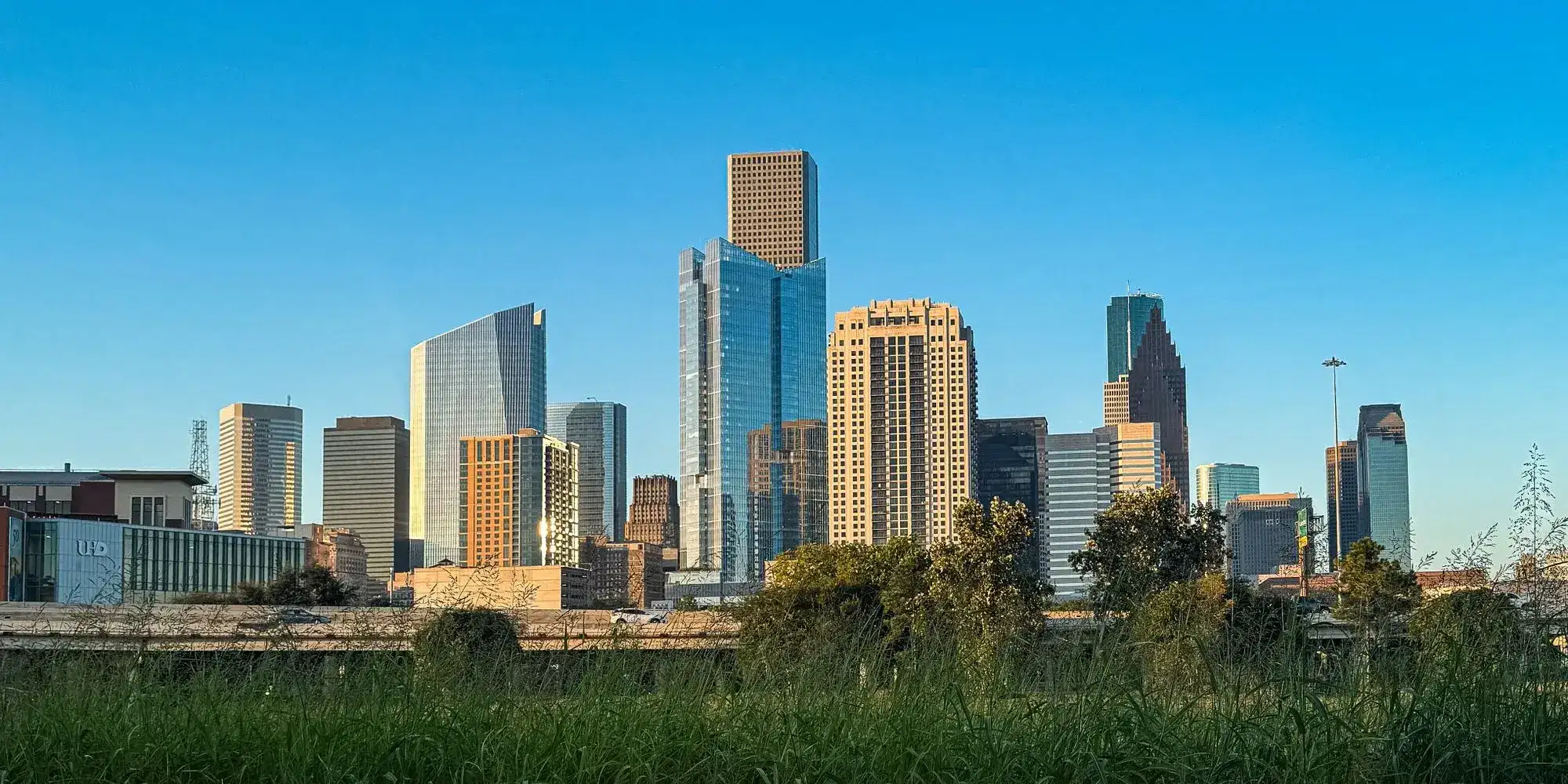 The downtown Houston skyline under a clear blue sky