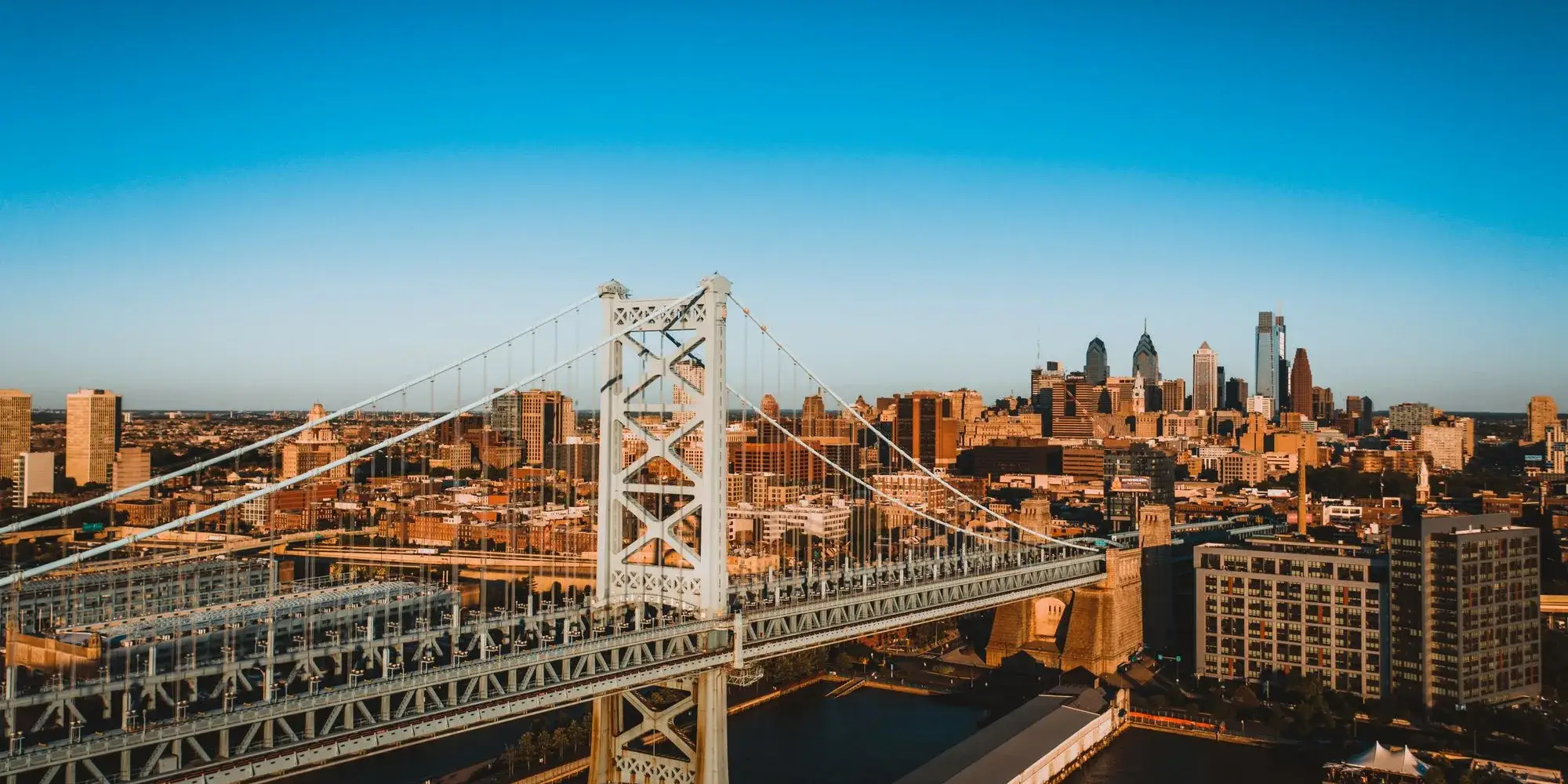 The Benjamin Franklin Bridge over the Delaware River with the Center City Philadelphia skyline behind it