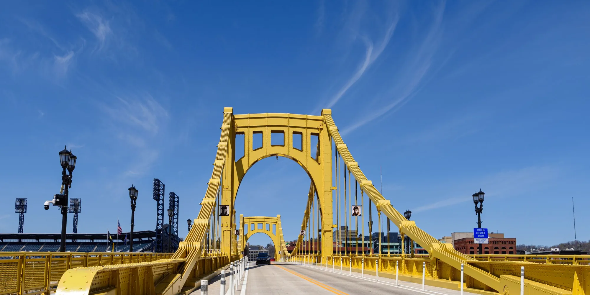 The Roberto Clemente Bridge in Pittsburgh under a clear sky