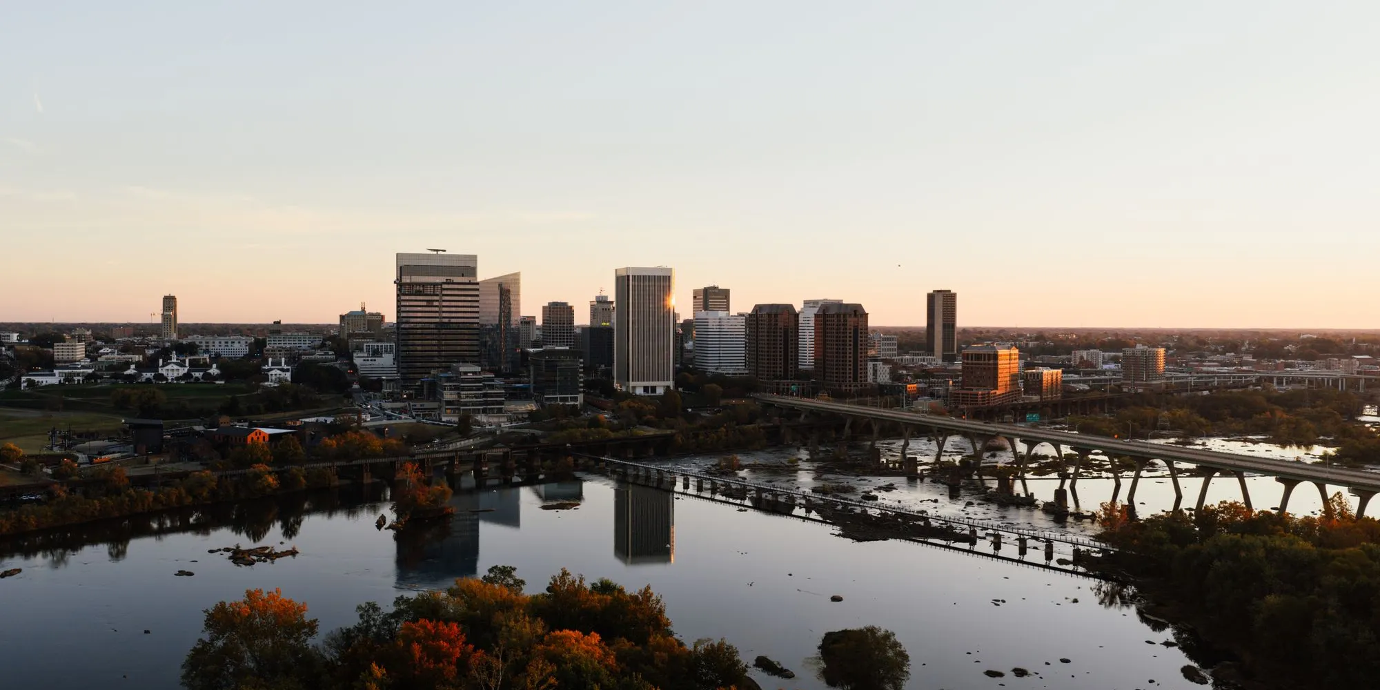The Richmond skyline at sunset above the James River