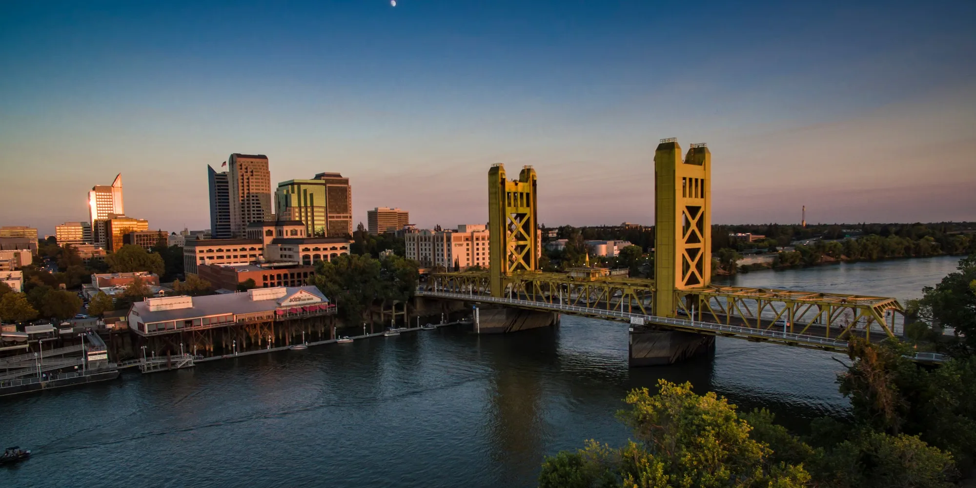 Sacramento's Tower Bridge over the river at dusk