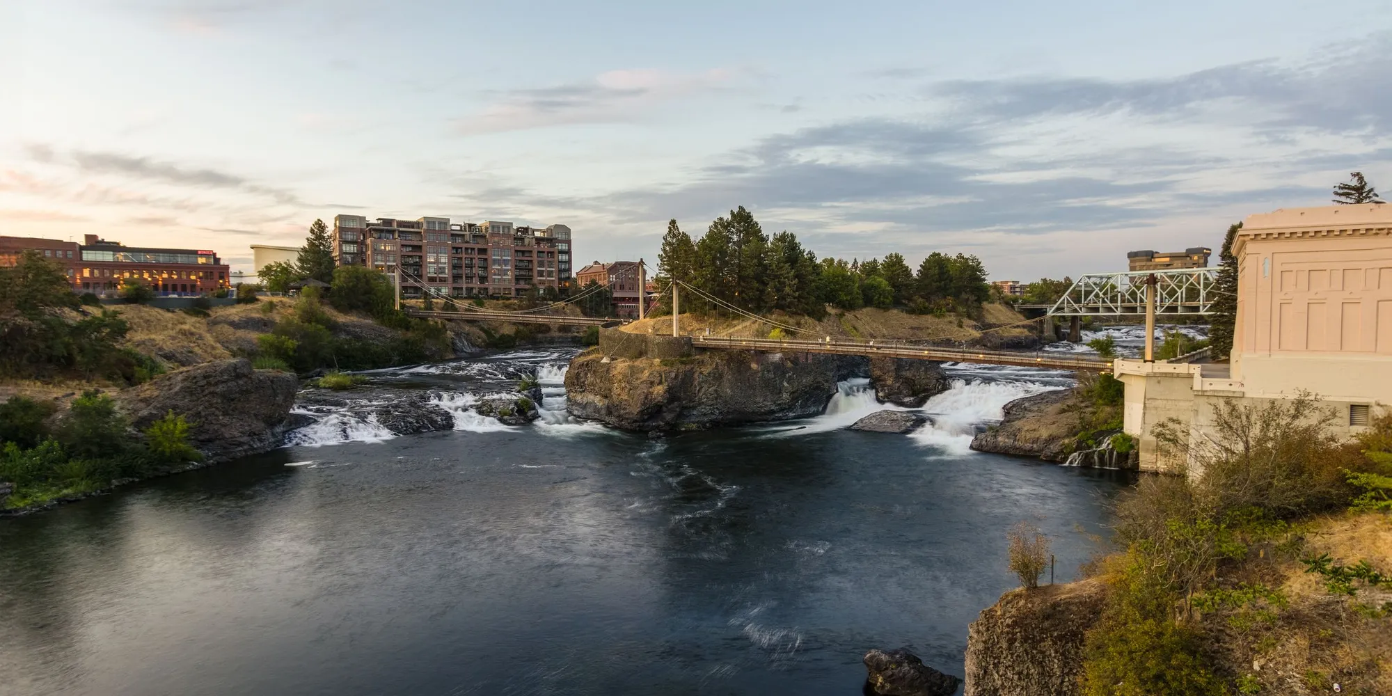 The Spokane Falls and the downtown skyline behind them